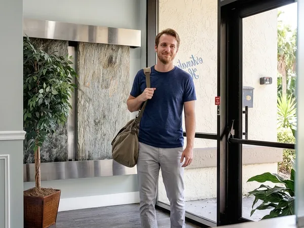 A new patient takes his first steps into the welcoming lobby of Destination Hope to begin recovery.