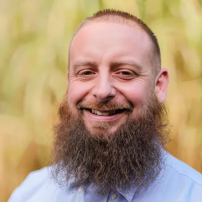 Professional male program director of outpatient services organizing behavioral health treatments.