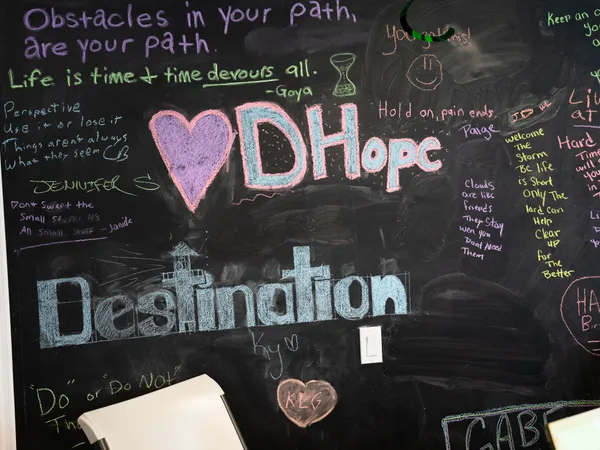 An inspirational chalkboard wall at Destination Hope covered with positive mental health and recovery quotes to encourage clients on their journey.