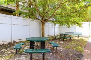 Courtyard with green tables